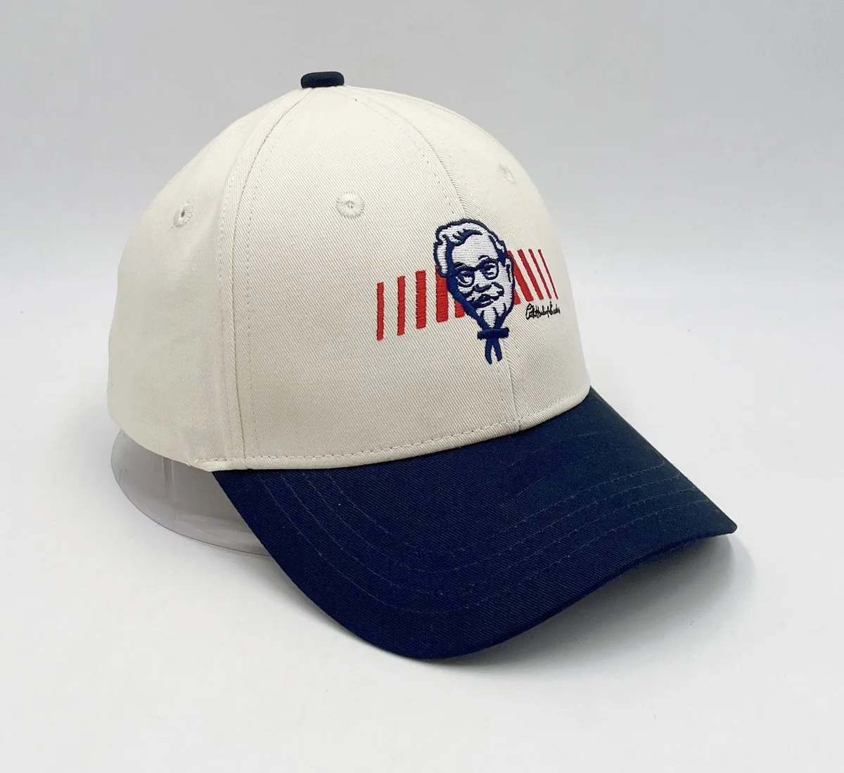 Cream and navy ponytail cap