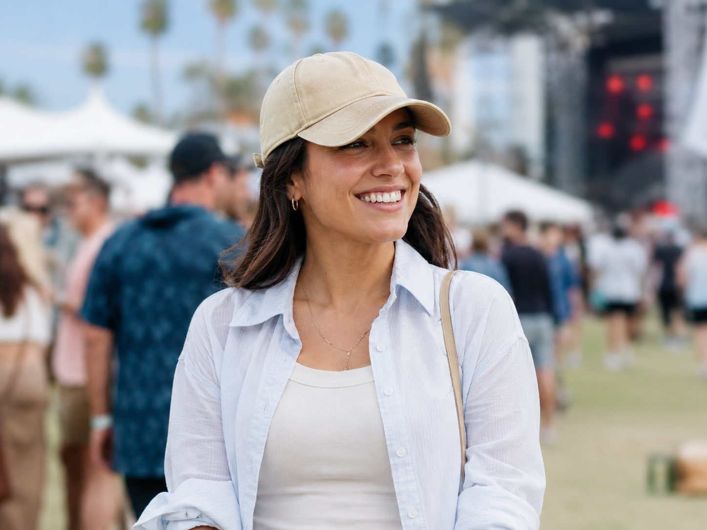 Woman wearing a cap at an outdoor event